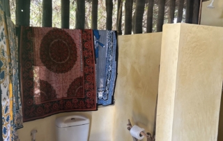 Toilet in budget rooms made with natural materials in Kwa Simba accommodation in Pangani, Tanzania Africa.